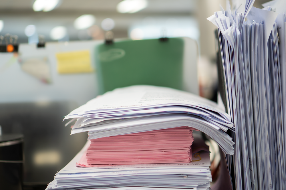 Stack of office documents and paperwork organized