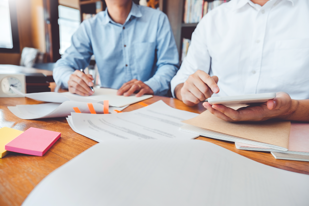 Professionals working on documents in office setting